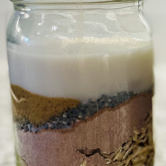 Overnight Oats with Almond Milk in Mason Jar Container