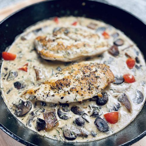 chicken breast in mushroom cream sauce in skillet