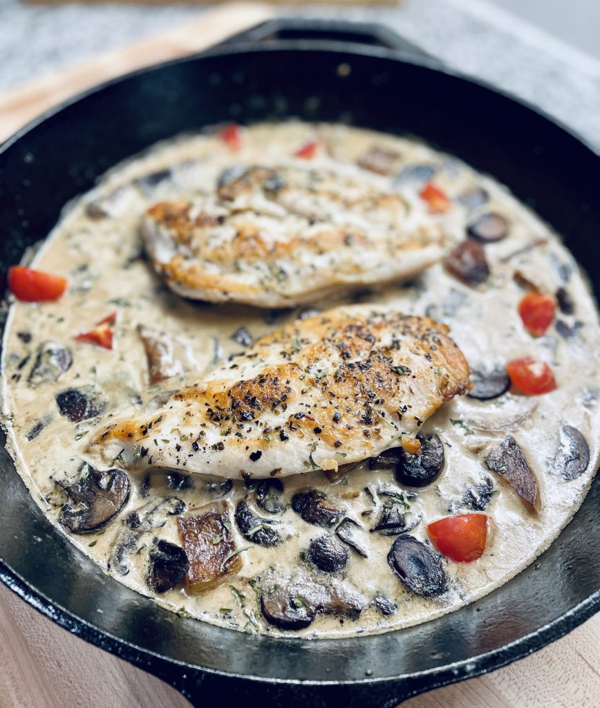 chicken breast in mushroom cream sauce in skillet