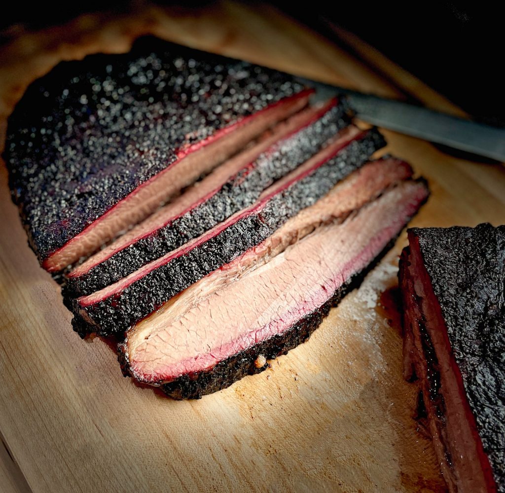 Sliced brisket on cutting board