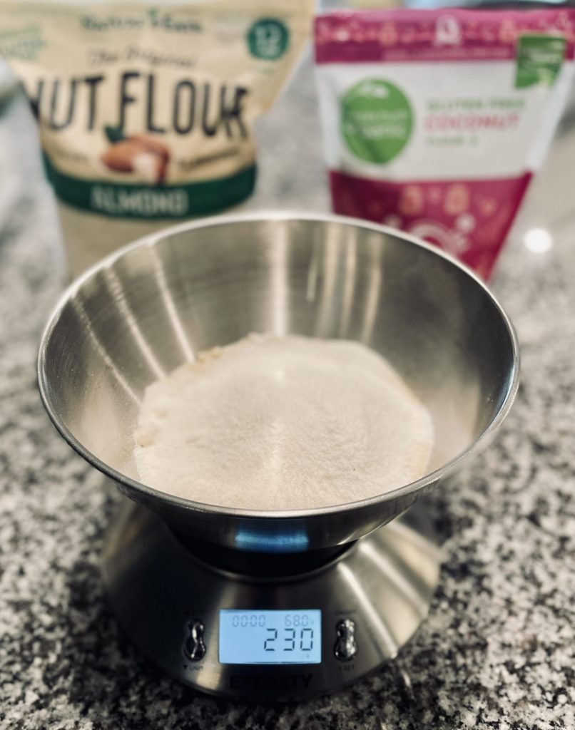 Almond flour on scale in mixing bowl