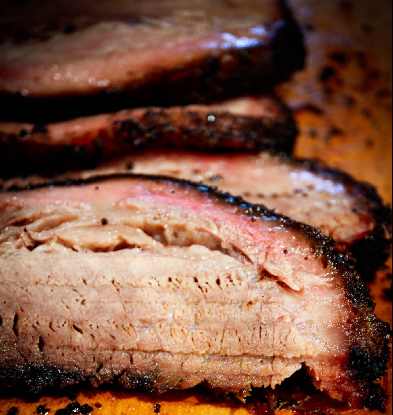 Sliced Smoked Brisket on Cutting Board