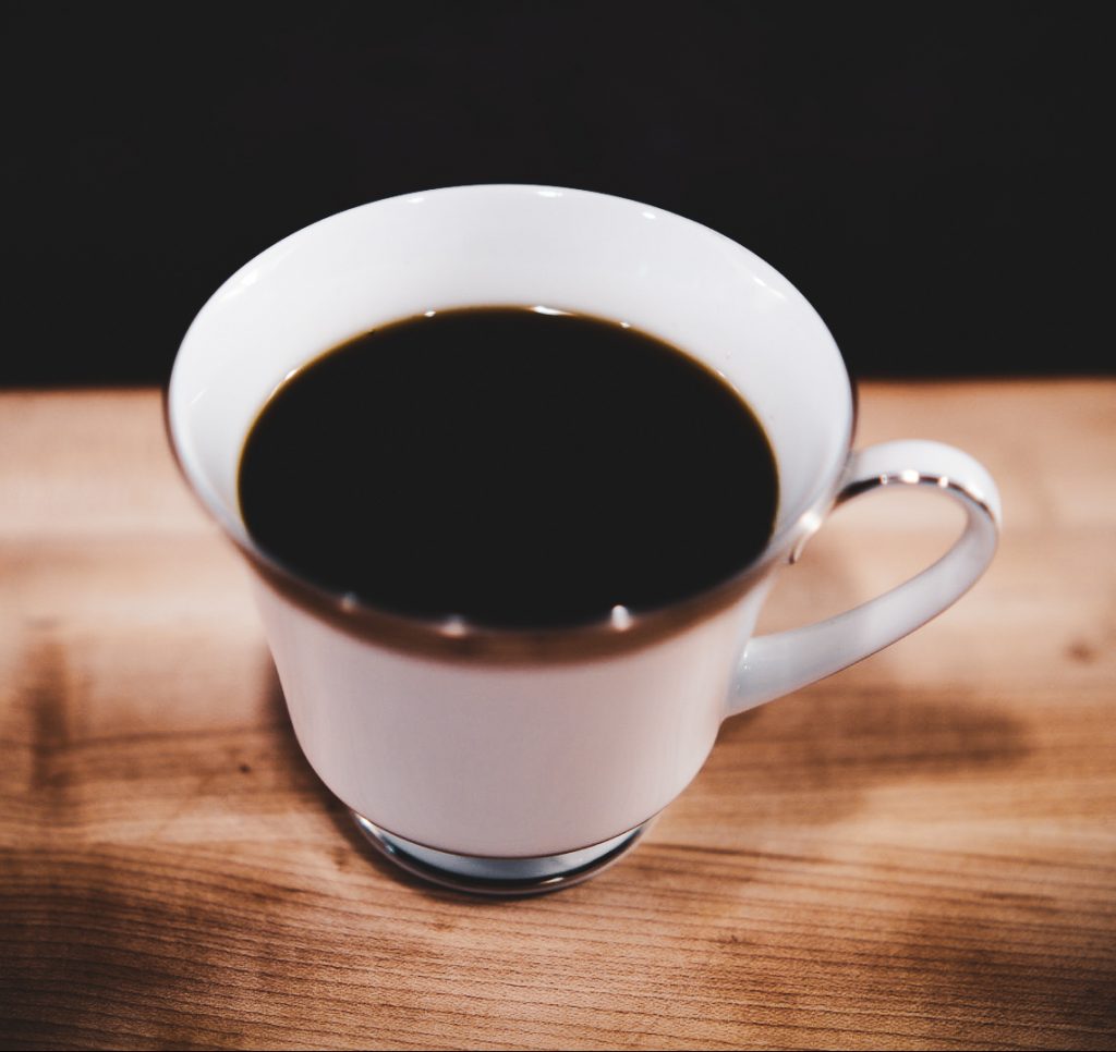 Freshly brewed hot coffee in china cup