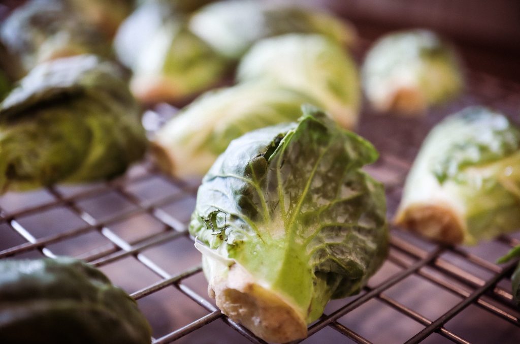 Raw Brussels Sprouts on cooling rack