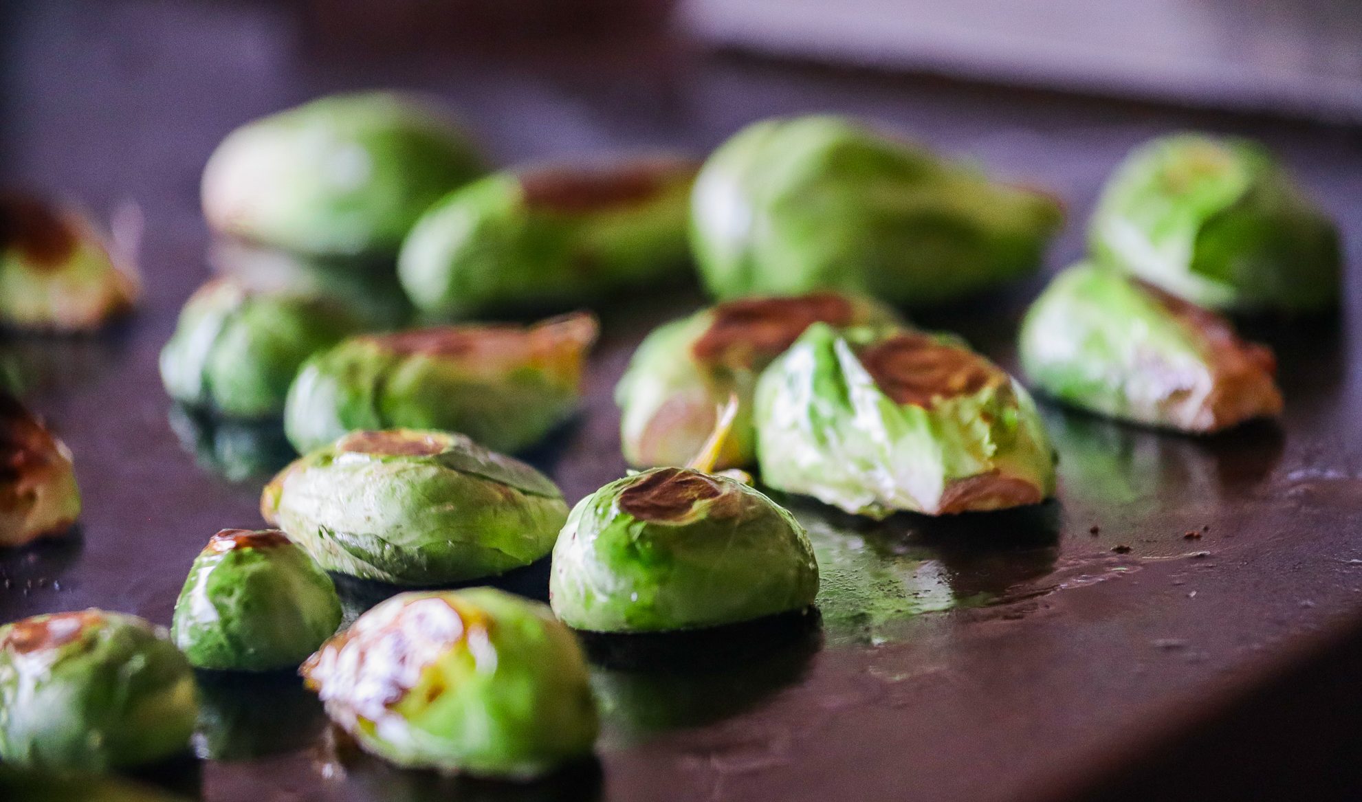 Sautéed Brussels Sprouts cooking on flat top grill