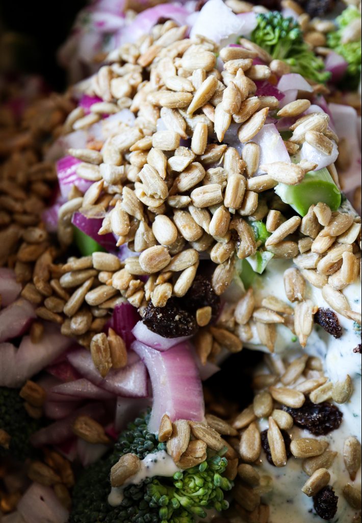 Close up of unmixed Paleo Broccoli Salad