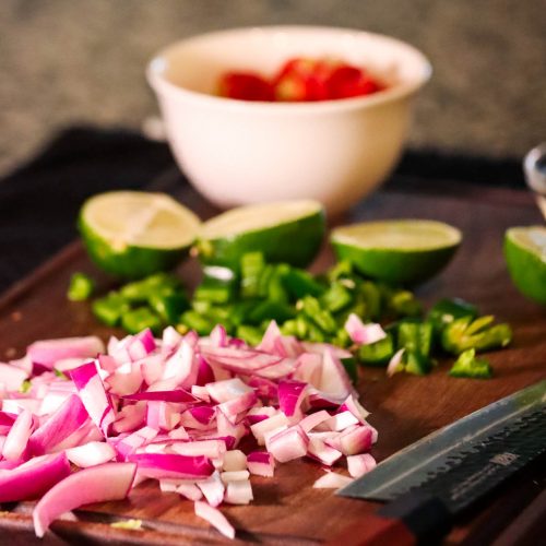 Chopped ingredients for Shrimp Ceviche on chopping board